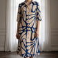 Damesjurk met knopen en geometrische print